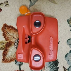 1980s Viewmaster 3D red and orange camera lever.